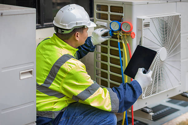 Professional Hvac technician working in Calera, AL